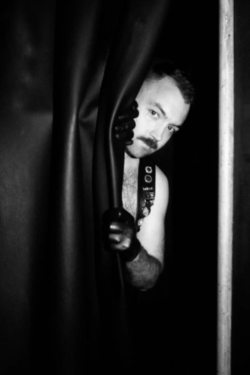 hobbler, peeking out from behind a curtain